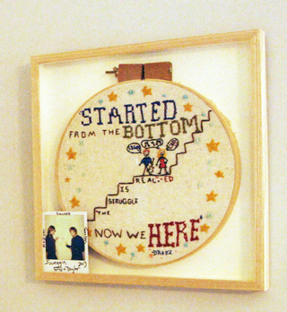 Illustration for article titled Taylor Swift made a Drake needlepoint, as Taylor Swift does